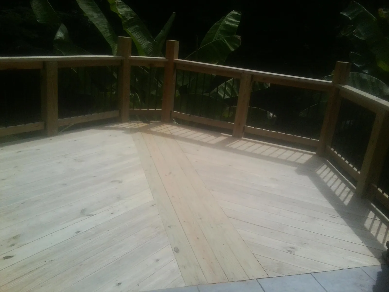 New wood deck and railing built off the back of a home in West Wardsboro